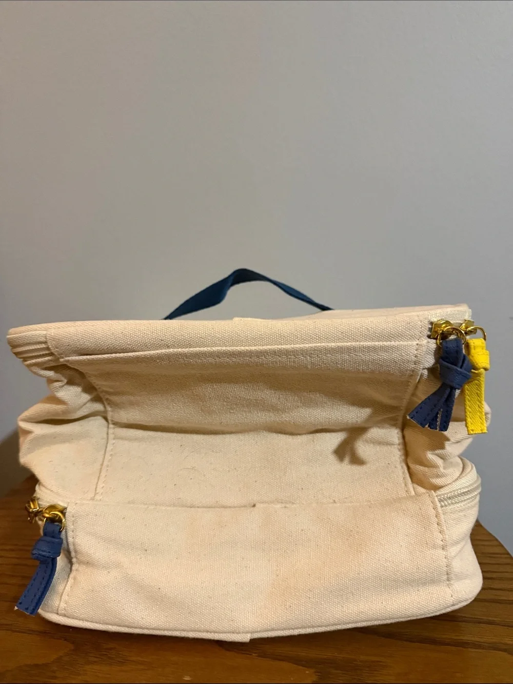 Chloe + Isabel Cream Canvas Cosmetic Pouch with Yellow & Navy Bird Logo